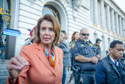 shutterstock557053660-1jpg Nancy Pelosi speaking outside a government building.