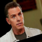 LEAKED Video: Hunter Biden PANICS — “Who Protects Me?” Man in a beige jacket looking at the camera.