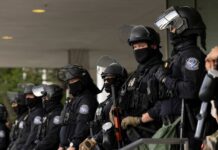 Bomb Threat at TOP Conservative Event—ARREST MADE… Group of police officers in riot gear standing in formation