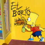Simpsons Prophecy Writer Enters 2028 RACE…. Graffiti of Bart Simpson writing El Barto was here on a yellow wall