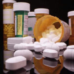 Pregnant Teen Drugged — Dad Accused Assorted prescription pill bottles and tablets scattered.