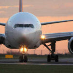 The Next Aviation Threat Is Already In Airports Airplane on runway during sunset.
