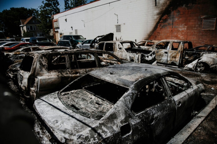 Burned cars in a parking lot after a fire