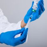 Abortion Pills Used As Weapon A healthcare professional preparing a syringe with a vaccine