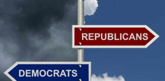 Street signs pointing to Democrats and Republicans direction.