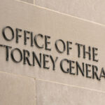 State Courts Target ICE — DOJ Braces Office of the Attorney General building sign.