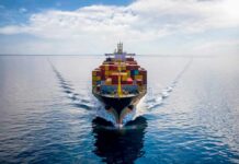 Container ship sailing on calm ocean