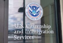 Quiet Memo, Massive Green Card Shake-Up Door with U.S. government seal and office lettering