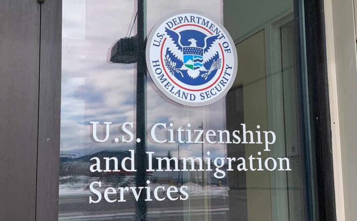 shutterstock_1932523304 Door with U.S. government seal and office lettering