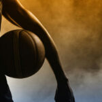 Federal Hammer Drops Transgender Athletes —Gov Pushes Back Basketball player silhouette with a ball in hand.
